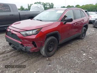 2019 Toyota RAV4 LE with VIN JTMH1RFV2KJ005625, listed as a IAAI auction lot 42187600 with 131,215 mi miles and . Bid and sale history available at DreamBid. Image 2.