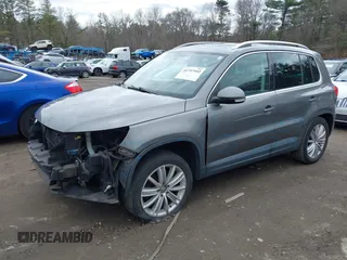 2011 Volkswagen Tiguan SE with VIN WVGBV7AX4BW532524, listed as a IAAI auction lot 41757552 with 141,115 mi miles and . Bid and sale history available at DreamBid. Image 2.