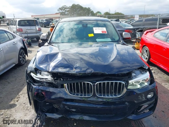2018 BMW X4 M40i with VIN 5UXXW7C52J0W63809, listed as a IAAI auction lot 41715259 with NaN miles. Bid and sale history available at carsss.com. Image 12.