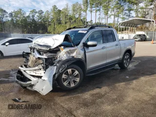 2017 Honda Ridgeline RTL-T with VIN 5FPYK2F6XHB002959, listed as a Copart auction lot 87286384 with 97,749 mi miles and Salvage title. Bid and sale history available at DreamBid. Image 1.