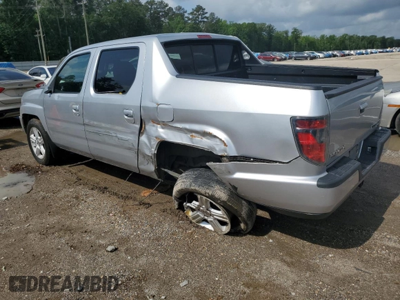 2014 Honda Ridgeline RTL with VIN 5FPYK1F58EB012869, listed as a Copart auction lot 51854995 with 318,950 mi miles and Salvage title. Bid and sale history available at DreamBid. Image 2.