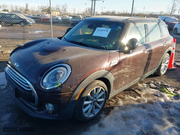2016 MINI Cooper Clubman with VIN WMWLN5C50G2E29740, listed as a IAAI auction lot 41345976 with 67,124 mi miles. Bid and sale history available at carsss.com. Image 2.