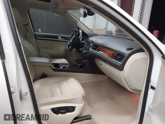 2012 Volkswagen Touareg Sport with VIN WVGFK9BP2CD002991, listed as a IAAI auction lot 42077523 with 94,515 mi miles and . Bid and sale history available at DreamBid. Image 5.