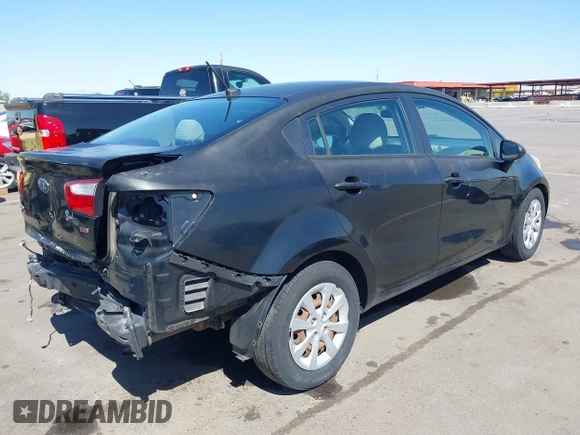 2014 Kia Rio LX with VIN KNADM4A39E6364490, listed as a IAAI auction lot 42128702 with 130,981 mi miles and . Bid and sale history available at DreamBid. Image 4.