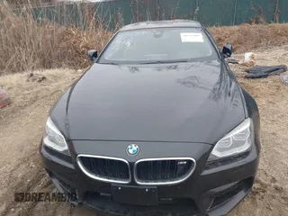 2014 BMW M6 z VIN WBSLX9C58ED160558, wystawiony jako IAAI lot #41553209 z przebiegiem 154 789 mil mil oraz . Historia ofert i sprzedaży dostępna na DreamBid. Obrazek 13.