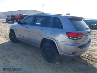 2018 Jeep Grand Cherokee Laredo E with VIN 1C4RJFAG0JC284927, listed as a IAAI auction lot 41964013 with 130,145 mi miles. Bid and sale history available at carsss.com. Image 3.