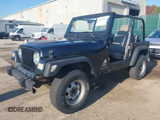 2004 Jeep Wrangler SE with VIN 1J4FA29144P797861, listed as a IAAI auction lot 42624721 with 156,867 mi miles and . Bid and sale history available at DreamBid. Image 2.