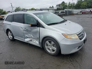 2011 Honda Odyssey Touring with VIN 5FNRL5H99BB021223, listed as a Copart auction lot 61171775 with 194,029 mi miles and Salvage title. Bid and sale history available at DreamBid. Image 4.