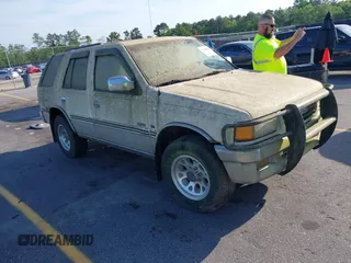 1995 Isuzu Rodeo z VIN 4S2CM58V5S4380421, wystawiony jako IAAI lot #42160950 z przebiegiem 196 071 mil mil oraz . Historia ofert i sprzedaży dostępna na DreamBid. Obrazek 1.