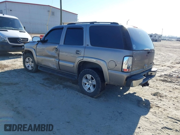 2003 Chevrolet Tahoe LS with VIN 1GNEK13Z03J294201, listed as a IAAI auction lot 41656836 with 302,922 mi miles. Bid and sale history available at carsss.com. Image 3.
