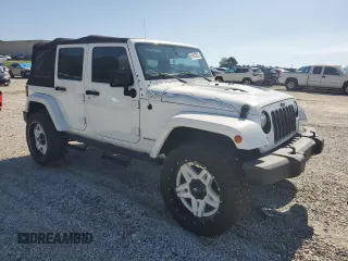 2015 Jeep Wrangler Unlimited Sahara with VIN 1C4BJWEG3FL584920, listed as a Copart auction lot 61843525 with 62,876 mi miles and Salvage title. Bid and sale history available at DreamBid. Image 4.