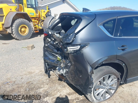 2020 Mazda CX-5 Grand Touring with VIN JM3KFBDM1L0821975, listed as a IAAI auction lot 40088794 with 68,895 mi miles and . Bid and sale history available at DreamBid. Image 21.