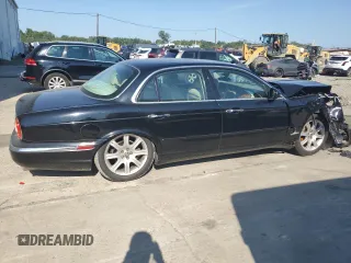 2004 Jaguar XJ with VIN SAJEA71C74SG02851, listed as a Copart auction lot 69056994 with 0 mi miles and Salvage Title. Bid and sale history available at carsss.com. Image 2.