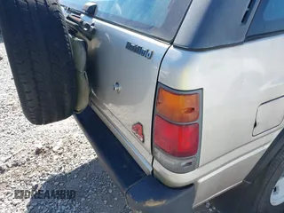 1995 Isuzu Rodeo z VIN 4S2CM58V4S4363500, wystawiony jako IAAI lot #41821801 z przebiegiem 94 480 mil mil oraz . Historia ofert i sprzedaży dostępna na DreamBid. Obrazek 12.
