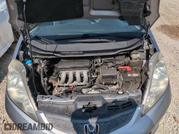 2010 Honda Fit Sport with VIN JHMGE8H41AC002070, listed as a Copart auction lot 62356565 with 148,279 mi miles and Salvage title. Bid and sale history available at DreamBid. Image 11.