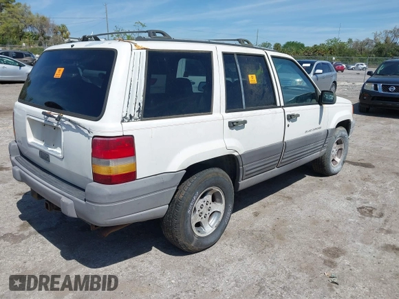 1996 Jeep Grand Cherokee Laredo with VIN 1J4EX58S6TC126610, listed as a IAAI auction lot 41801779 with 1 mi miles. Bid and sale history available at carsss.com. Image 4.