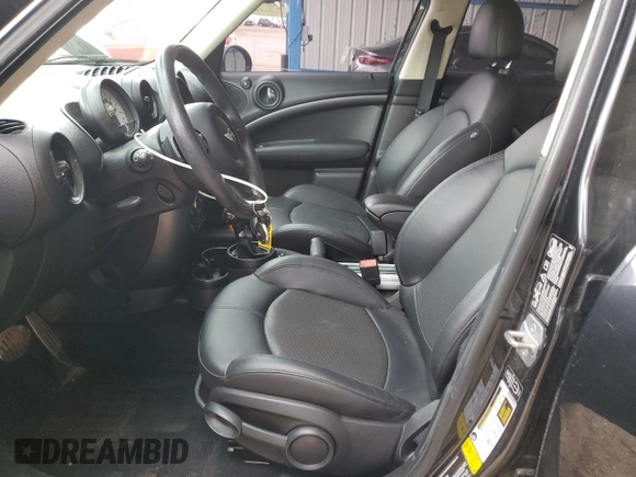 2014 MINI Countryman S with VIN WMWZC5C56EWP38065, listed as a Copart auction lot 59518395 with 91,106 mi miles and Salvage title. Bid and sale history available at DreamBid. Image 7.