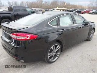 2017 Ford Fusion Titanium z VIN 3FA6P0K98HR200272, wystawiony jako IAAI lot #41905017 z przebiegiem 104 132 mil mil oraz . Historia ofert i sprzedaży dostępna na DreamBid. Obrazek 4.