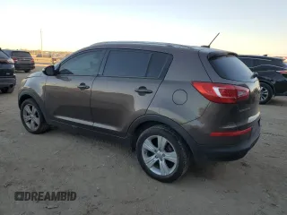 2013 Kia Sportage LX z VIN KNDPB3A23D7465413, wystawiony jako Copart lot #79964134 z przebiegiem 122 467 mil mil oraz Szkoda całkowita • Salvage title. Historia ofert i sprzedaży dostępna na DreamBid. Obrazek 2.