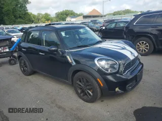 2012 MINI Countryman S with VIN WMWZC3C50CWM28043, listed as a Copart auction lot 64701505 with 166,819 mi miles and Salvage title. Bid and sale history available at DreamBid. Image 4.
