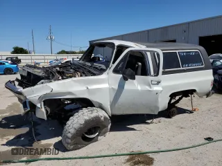 1990 GMC Jimmy z VIN 1GKEV18K4LF509467, wystawiony jako Copart lot #52405495 z przebiegiem 409 007 mil mil oraz Nie do naprawy • Non repairable. Historia ofert i sprzedaży dostępna na DreamBid. Obrazek 1.