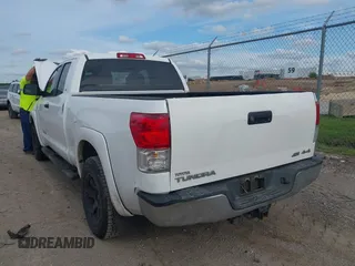 2012 Toyota Tundra with VIN 5TFUW5F16CX225421, listed as a IAAI auction lot 42210783 with 207,025 mi miles and . Bid and sale history available at DreamBid. Image 3.