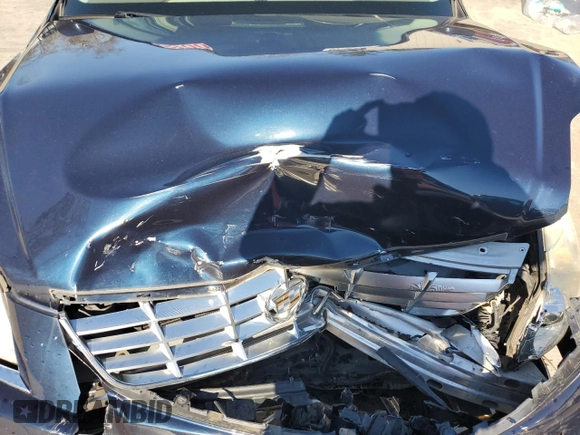 2006 Cadillac DTS 1SB z VIN 1G6KD57Y56U220535, wystawiony jako Copart lot #89196185 z przebiegiem 94 312 mil mil oraz Szkoda całkowita • Salvage title. Historia ofert i sprzedaży dostępna na DreamBid. Obrazek 11.