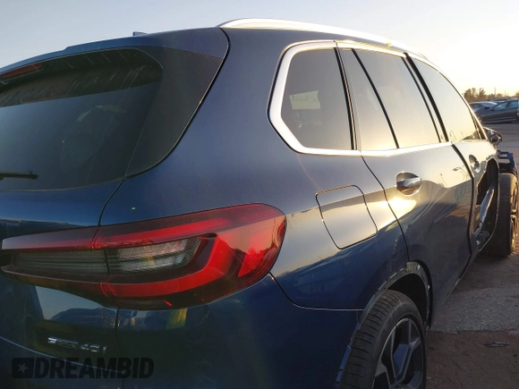 2021 BMW X5 sDrive40i with VIN 5UXCR4C01M9F02587, listed as a IAAI auction lot 41111144 with 23,844 mi miles. Bid and sale history available at carsss.com. Image 4.