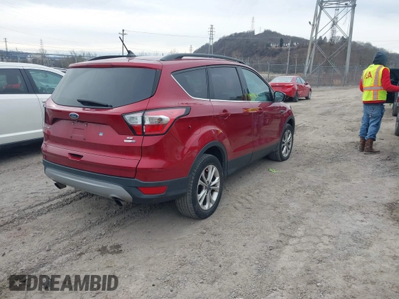 2018 Ford Escape SE z VIN 1FMCU9GD6JUA18684, wystawiony jako IAAI lot #41499540 z przebiegiem 105 127 mil mil oraz . Historia ofert i sprzedaży dostępna na DreamBid. Obrazek 4.