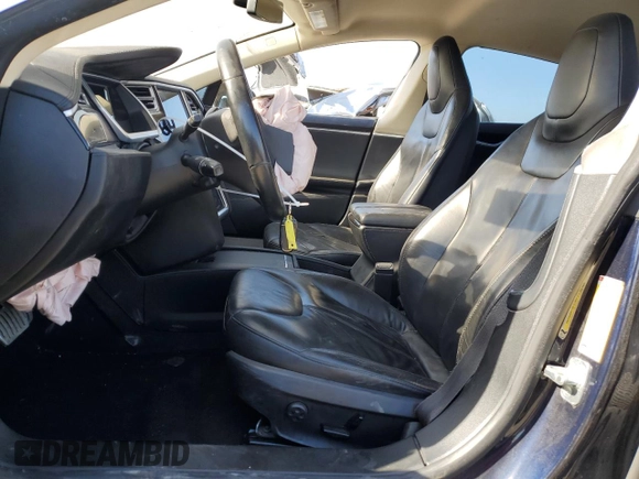 2014 Tesla Model S 60 with VIN 5YJSA1H13EFP38425, listed as a Copart auction lot 63686205 with 183,968 mi miles and Salvage title. Bid and sale history available at DreamBid. Image 7.