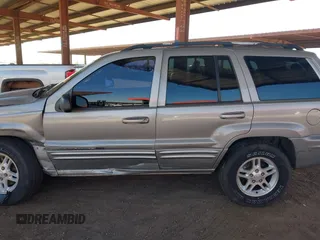 2000 Jeep Grand Cherokee Limited z VIN 1J4GW58N1YC206992, wystawiony jako IAAI lot #42057236 z przebiegiem 183 986 mil mil oraz . Historia ofert i sprzedaży dostępna na DreamBid. Obrazek 14.