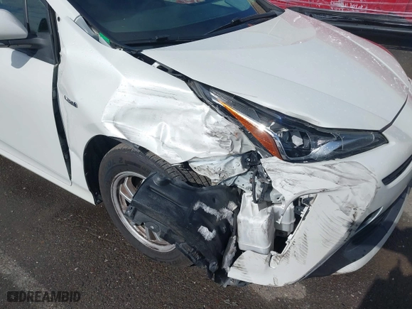 2019 Toyota Prius L Eco with VIN JTDKARFU7K3093038, listed as a IAAI auction lot 41768066 with 124,495 mi miles. Bid and sale history available at carsss.com. Image 6.