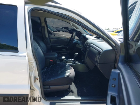 2004 Jeep Grand Cherokee Laredo z VIN 1J4GX48S74C152542, wystawiony jako IAAI lot #42350507 z przebiegiem 176 366 mil mil oraz . Historia ofert i sprzedaży dostępna na DreamBid. Obrazek 5.