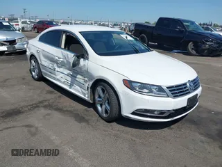 2014 Volkswagen CC Sport with VIN WVWBP7AN5EE504545, listed as a IAAI auction lot 42572797 with 132,630 mi miles and . Bid and sale history available at DreamBid. Image 1.