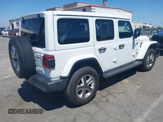 2019 Jeep Wrangler Unlimited Sahara with VIN 1C4HJXENXKW684942, listed as a IAAI auction lot 42021869 with 55,137 mi miles and . Bid and sale history available at DreamBid. Image 4.