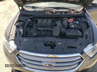 2015 Ford Taurus SEL with VIN 1FAHP2E8XFG209390, listed as a Copart auction lot 58992305 with 99,498 mi miles and Salvage title. Bid and sale history available at DreamBid. Image 11.