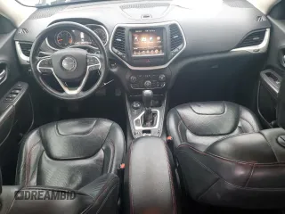 2015 Jeep Cherokee Trailhawk z VIN 1C4PJMBS9FW698857, wystawiony jako Copart lot #86572504 z przebiegiem 143 919 mil mil oraz Czysty tytuł • Clean title. Historia ofert i sprzedaży dostępna na DreamBid. Obrazek 8.
