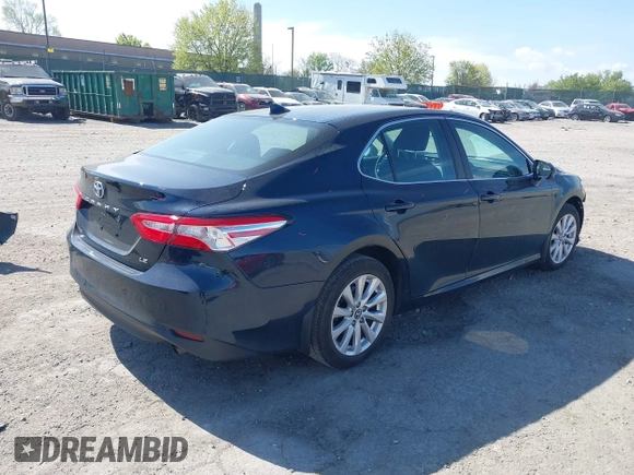 2019 Toyota Camry LE with VIN 4T1B11HK3KU254083, listed as a IAAI auction lot 42091530 with 26,635 mi miles and . Bid and sale history available at DreamBid. Image 4.