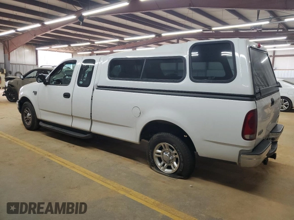 2001 Ford F-150 XL with VIN 1FTRX17L51NB25752, listed as a Copart auction lot 48721235 with 179,941 mi miles and Salvage title. Bid and sale history available at DreamBid. Image 2.