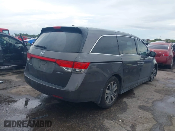 2016 Honda Odyssey Touring Elite with VIN 5FNRL5H97GB010048, listed as a IAAI auction lot 40212711 with 119,009 mi miles and . Bid and sale history available at DreamBid. Image 4.