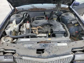 1990 Cadillac DeVille z VIN 1G6CD5337L4238206, wystawiony jako Copart lot #58214584 z przebiegiem Nie podano mil oraz Szkoda całkowita • Salvage title. Historia ofert i sprzedaży dostępna na DreamBid. Obrazek 11.