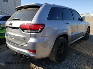 2018 Jeep Grand Cherokee with VIN NJ1454E, listed as a Copart auction lot 48051693 with 66,894 mi miles and Salvage title. Bid and sale history available at DreamBid. Image 3.