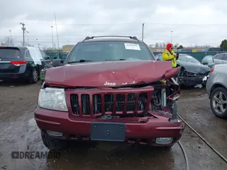 1999 Jeep Grand Cherokee Limited with VIN 1J4GW68N5XC642670, listed as a IAAI auction lot 41990199 with 154,492 mi miles. Bid and sale history available at carsss.com. Image 13.