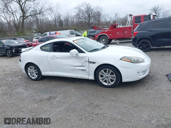 2008 Hyundai Tiburon GS z VIN KMHHM66D58U283273, wystawiony jako IAAI lot #41900097 z przebiegiem 154 013 mil mil oraz . Historia ofert i sprzedaży dostępna na DreamBid. Obrazek 14.