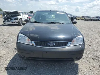2006 Ford Focus S with VIN 1FAFP34N76W246035, listed as a Copart auction lot 61985015 with 196,498 mi miles and Salvage title. Bid and sale history available at DreamBid. Image 5.