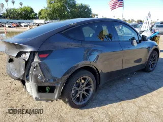2024 Tesla Model Y with VIN 7SAYGDED3RF151031, listed as a Copart auction lot 49494165 with 7,503 mi miles and Salvage Title. Bid and sale history available at DreamBid. Image 3.