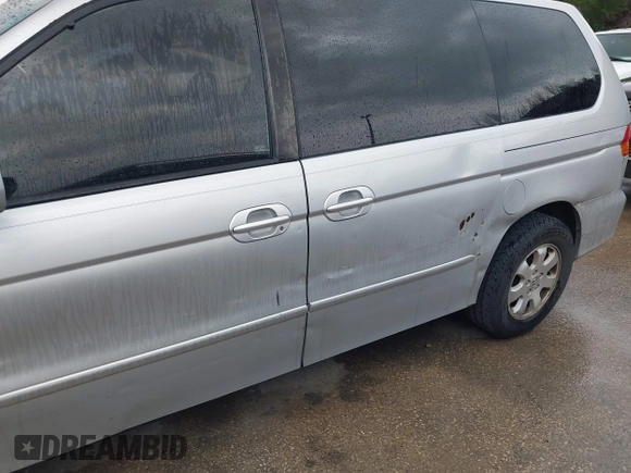 2004 Honda Odyssey EX with VIN 5FNRL18694B076305, listed as a IAAI auction lot 41929212 with 287,717 mi miles and . Bid and sale history available at DreamBid. Image 6.