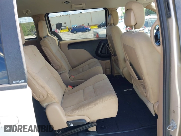 2014 Dodge Grand Caravan SXT with VIN 2C4RDGCGXER322705, listed as a IAAI auction lot 42170301 with 147,070 mi miles and . Bid and sale history available at DreamBid. Image 8.