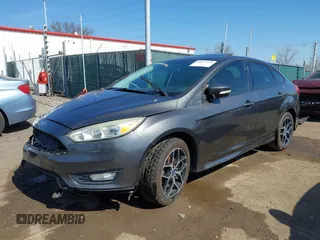 2015 Ford Focus SE with VIN 1FADP3F29FL268677, listed as a IAAI auction lot 42037244 with 118,018 mi miles. Bid and sale history available at carsss.com. Image 2.