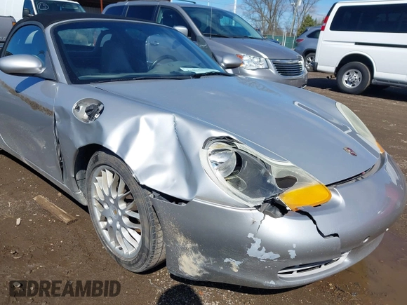 1999 Porsche Boxster z VIN WP0CA2989XU627152, wystawiony jako IAAI lot #41805432 z przebiegiem 112 380 mil mil oraz . Historia ofert i sprzedaży dostępna na DreamBid. Obrazek 6.
